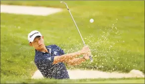  ?? Gregory Shamus / Getty Images ?? Collin Morikawa plays a shot from a bunker on the seventh hole during the final round of the Workday Charity Open on Sunday at Muirfield Village Golf Club in Dublin, Ohio. Morikawa won in a playoff against Justin Thomas.