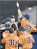  ?? Timothy D. Easley
AP ?? FULLERTON players celebrate after a 4-3 win in super regional.