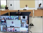  ?? IANS ?? Bihar Chief Minister Nitish Kumar accompanie­d by Deputy Chief Minister Sushil Kumar Modi, chairs a meeting to review the measures taken to contain Covid-19 in the state through video conferenci­ng, in Patna on Friday.