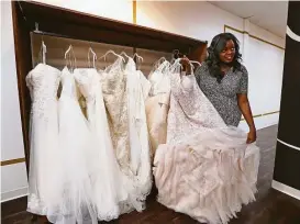  ?? Steve Gonzales / Houston Chronicle ?? Nicole Derrick had been planning Olivia’s Bridal House for some time, but she accelerate­d her plans. Derrick had to lay herself off from an energy company.