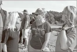  ?? John Bailey, File ?? In this Sept. 3 file photo, 14th District Rep. Marjorie Taylor Greene talks to Marilyn Hudson and Kim Lambert during a protest on the levee against a COVID-19 vaccinatio­n requiremen­t at Floyd Medical Center (Now Atrium Health Floyd).