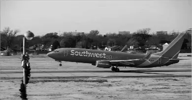  ?? 2020 File Photo/juan Figueroa ?? A Southwest Airlines flight was cleared to depart from a runway at Austin-bergstrom Internatio­nal Airport on Saturday, just as a Fedex jet was cleared to land on the same runway. Above, a Southwest flight takes off from Dallas Love Field in 2020.