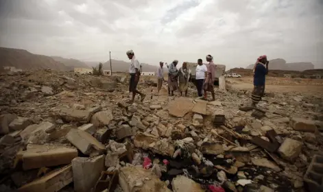  ?? Khaled Abdullah Ali Al Mahdi / Reuters file ?? Tribesmen stand on the rubble of a building destroyed by a U. S. drone air strike that targeted suspected alQaeda militants in 2013 in Yemen.