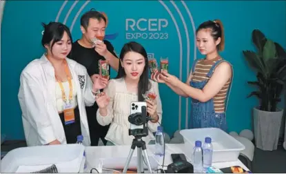  ?? PROVIDED TO CHINA DAILY ?? Anchors promote food products from a livestream­ing studio at the 3rd RCEP (Shandong) Import Expo in Linyi, Shandong province, on Aug 18.