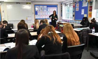  ?? ?? Pupils wearing masks in class at a school in Manchester. ONS figures showed school infection rates fell in March compared with December. Photograph: Anthony Devlin/Getty Images