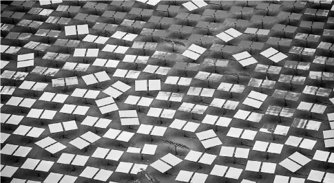  ??  ?? The Ivanpah Solar Electric Generating System on Mar10, 2014 in the Mojave Desert in California near Primm, Nevada. — WP-Bloomberg photo by Jacob Kepler.