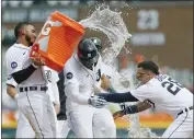  ?? DUANE BURLESON – GETTY IMAGES/TNS ?? Victor Reyes of the Tigers gets doused by Harold Castro, left, after hitting a two-run double in the bottom of the ninth inning to beat the Padres 4-3on Wednesday.