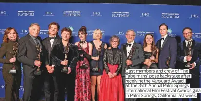  ?? Photos: Instagram, Twitter, AFP, Reuters, IANS ?? Cast members and crew of ‘The Fabelmans’ pose backstage after receiving the Vanguard Award, at the 34th Annual Palm Springs Internatio­nal Film Festival Awards gala in Palm Springs, California last week.