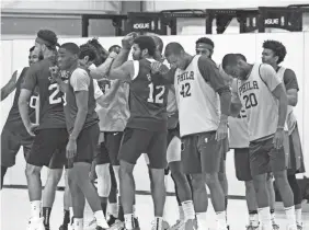  ?? MADISON QUISENBERR­Y/NBAE VIA GETTY IMAGES ?? The 76ers huddle up during practice as part of the NBA Restart 2020 on Monday.