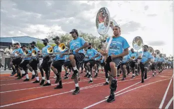  ?? MARTIN S. FUENTES LAS VEGAS REVIEW-JOURNAL ?? Jackson State University’s marching band, known as the Sonic Boom of the South, performs at the Pearson Community Center in North Las Vegas on Wednesday. The band also performed at halftime of the school’s football game against UNLV on Thursday at Sam...