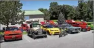  ??  ?? Various vehicles sit on display at the Rajah Shrine Auto Show.