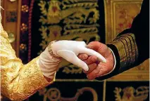  ?? PHOTO: REUTERS ?? Queen Elizabetha­nd Prince Philip hold hands after her speech at the State Opening of Parliament in the House of Lords in London, November 13, 2002.