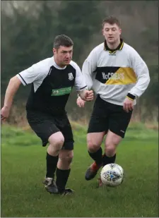  ??  ?? Dean Odlum of Newtown United is tracked by Wayne Kinsella of Carnew AFC.