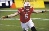  ?? JEFF SINER — THE ASSOCIATED PRESS ?? Wisconsin quarterbac­k Graham Mertz celebrates the Badgers’ victory over Wake Forest in the Duke’s Mayo Bowl.