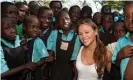  ??  ?? Girls Aloud’s Kimberley Walsh with school children in Uganda. Comic Relief announced it will stop sending celebritie­s to African nations. Photograph: Comic Relief/ Getty Images