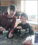  ??  ?? Cathal and Pádraig enjoying their hot chocolates.