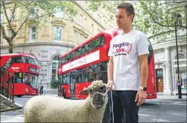  ?? Vudi Xhymshiti Associated Press ?? DEMONSTRAT­ORS walk sheep through central London last week as part of a protest to point up disruption­s that Brexit poses to farmers who raise livestock.