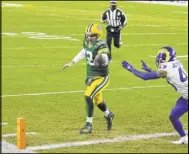  ?? Matt Ludtke The Associated Press ?? Green Bay’s Aaron Rodgers runs past John Johnson for a 1-yard touchdown in a 32-18 victory that put the Packers in the NFC championsh­ip game.