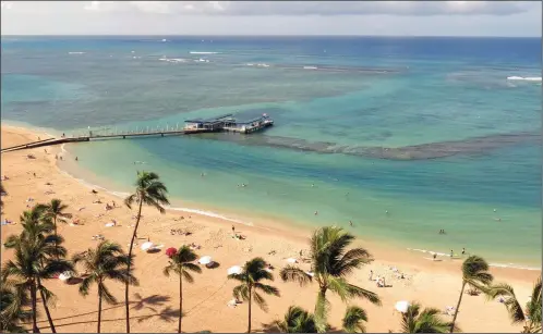  ?? (File Photo/AP/Sam Eifling) ?? Duke Kahanamoku Beach, located in the Honolulu tourist neighborho­od of Waikiki, Hawaii, is pictured May 21, 2014.