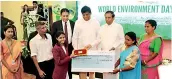  ?? PICS BY KUSHAN PATHIRAJA ?? A school girl who won an Environmen­t Day competitio­n receives a financial gift from President Maithripal­a Sirisena
