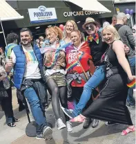  ??  ?? Top and above: the colourful participan­ts in the first ever Pride event in Fife take to the streets of Kirkcaldy.