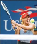  ?? Associated Press photo ?? In this Aug. 27, 2014, file photo, Maria Sharapova, of Russia, returns a shot to Alexandra Dulgheru, of Romania, during the second round of the U.S. Open tennis tournament, in New York.