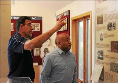  ?? CHARLES PRITCHARD - ONEIDA DAILY DISPATCH ?? Executive Director Edward Brophy, left, gives Assembly Speaker Carl Heastie a tour of the Internatio­nal Boxing Hall of Fame on Tuesday, Aug. 28, 2018.