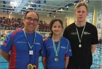  ??  ?? Coach Eduardo Santos, Danielle Farrell and Peter Mooney with their medals.