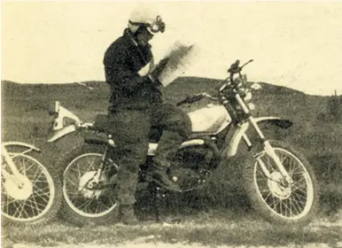  ?? ?? Astride the Elsinore, Bruce Preston studies the map at the top of the White Horse Ridge.