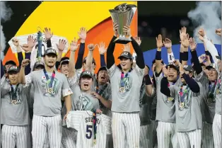  ?? WILFREDO LEE — THE ASSOCIATED PRESS ?? Shohei Otani holds up the trophy after Japan defeated the United States, 3-2, to win the World Baseball Classic for the third time.