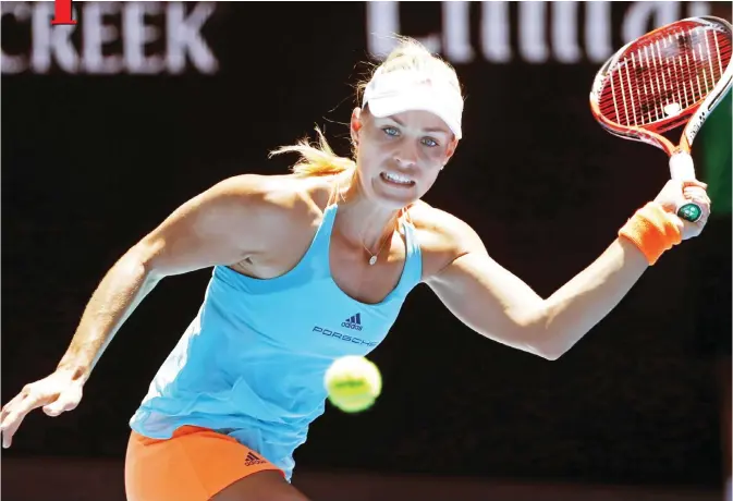  ??  ?? MELBOURNE: Germany’s Angelique Kerber eyes on the ball to make a forehand return to compatriot Carina Witthoeft during their second round match at the Australian Open tennis championsh­ips in Melbourne, Australia, yesterday. — AP