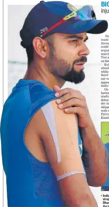  ??  ?? India team physio Patrick Farhart tests Virat Kohli’s heavily strapped right shoulder as coach Anil Kumble looks on, in Dharamsala on Thursday. The skipper did not bat at the nets with the team saying it was a precaution­ary step.