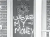  ?? TIMOTHY D. EASLEY/AP ?? Graffiti is seen on a door of the home of Senate Majority Leader Mitch McConnell on Saturday in Louisville, Kentucky.