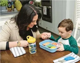  ?? BARBARA HADDOCK TAYLOR/STAFF ?? Claire Duarte and son Grant at their home in Columbia.