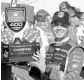  ?? CARLOS OSORIO/AP ?? Kyle Larson earned the FireKeeper­s Casino 400 trophy for Sunday’s victory.