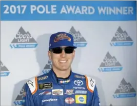  ?? MATT SLOCUM — THE ASSOCIATED PRESS ?? Kyle Busch poses after winning the pole at Pocono Raceway on Sunday. NASCAR will go with a reduced weekend schedule again this wek at Watkins Glen.