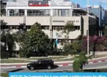  ??  ?? HERZLIYA: The Guatemalan flag is seen outside a building housing the offices of the Central American nation’s embassy near Tel Aviv yesterday. — AFP