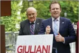 ?? MARY ALTAFFER-ASSOCIATED PRESS ?? Andrew Giuliani, right, a Republican candidate for Governor of New York, is joined by his father, former New York City mayor Rudy Giuliani, during a news conference, June 7 in New York.