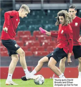  ??  ?? Young guns David Brooks and Ethan Ampadu go toe-to-toe