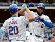  ?? Adam Hunger/getty Images ?? The Mets’ Starling Marte is congratula­ted by Pete Alonso after hitting a two-run home run in the third inning against the Pirates on Wednesday.