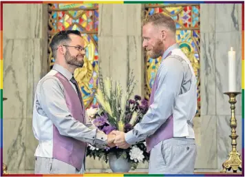  ?? CLAIRE COVILLE, TWO CROWS JOY PHOTOGRAPH­Y ?? There was hardly a dry eye in the chapel where Mike Butler and Ian Brunton exchanged wedding vows and were pronounced husbands. Their July 14 wedding coincided coincident­ally with Wolfville’s kickoff of Pride.