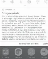  ?? THE CANADIAN PRESS ?? An emergency alert is seen on a mobile phone in Toronto last week. It could be a year before Canada’s new mobile emergency-alert system is tested on a wide scale again.