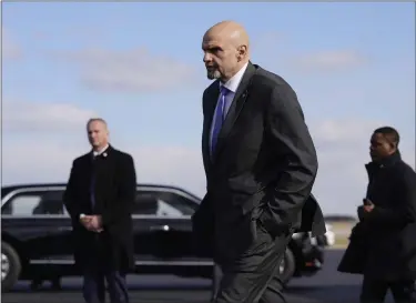  ?? PATRICK SEMANSKY — THE ASSOCIATED PRESS FILE ?? Sen. John Fetterman, D-PA., walks to a motorcade vehicle after stepping off Air Force One behind President Joe Biden on , Feb. 3at Philadelph­ia Internatio­nal Airport in Philadelph­ia. On Thursday, Feb. 16, Fetterman’s office announced that the senator had checked himself into the hospital for clinical depression.