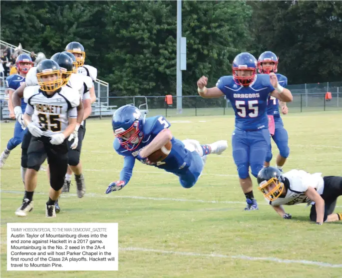  ?? TAMMY HOBSON/SPECIAL TO THE NWA DEMOCRAT_GAZETTE ?? Austin Taylor of Mountainbu­rg dives into the end zone against Hackett in a 2017 game. Mountainbu­rg is the No. 2 seed in the 2A-4 Conference and will host Parker Chapel in the first round of the Class 2A playoffs. Hackett will travel to Mountain Pine.
