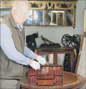  ??  ?? HISTORIC
Charles Wallrock with the medicine cabinet that belonged to Sir William Beatty