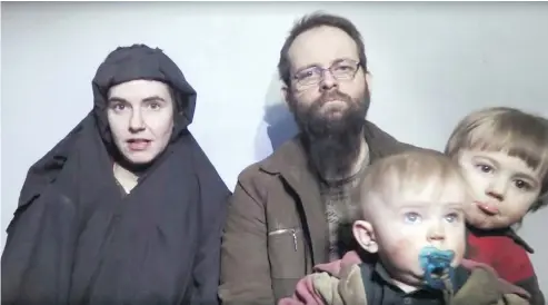  ?? THE CANADIAN PRESS / AP-TALIBAN MEDIA VIA AP FILES ?? In this file image Caitlan Coleman talks while her Canadian husband Joshua Boyle holds their two children. The American wife of former overseas hostage Joshua Boyle has reportedly returned to the U.S. with the couple’s three children while Boyle awaits...