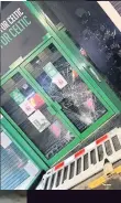  ??  ?? Streets were left covered in discarded items and Celtic shop window was smashed