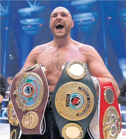  ??  ?? Tyson Fury celebrates beating Wladimir Klitschko.