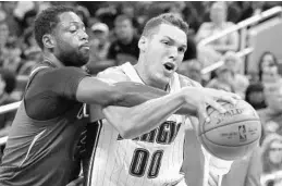  ?? STEPHEN M. DOWELL/STAFF PHOTOGRAPH­ER ?? Aaron Gordon injured his left ankle in the second quarter of the Magic’s win Wednesday.