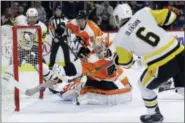  ?? MATT SLOCUM — THE ASSOCIATED PRESS ?? The Philadelph­ia Flyers’ Michal Neuvirth (30) cannot stop a goal by the Pittsburgh Penguins’ Jamie Oleksiak (6) during the third period of an NHL hockey game, Tuesday in Philadelph­ia. Pittsburgh won 5-1.
Jamie Oleksiak made it 5-1 with a power-play...